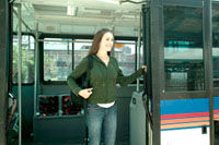 Girl getting off the bus.